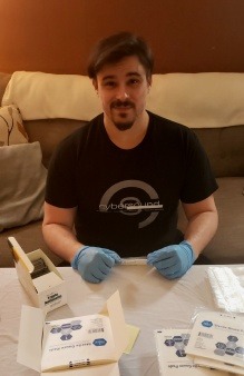 Alastair Huntley assembling first aid kits to support harm reduction efforts in Vermont and New Hampshire.