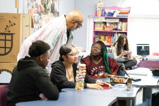 JustFlix instructor and youth participants discussing film production
