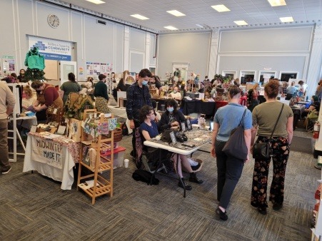 Image features a recent fall 2024 art market in the inside of the Equality Community Center