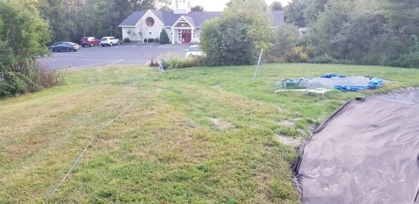 this photo shows where the walkway will start from the paved driveway and cross over the lawn