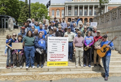 Fix the Grid - Rally for Reform May 2025 Activists gather on the steps across from the MA Statehouse in Boston for a Fix the Grid rally