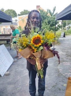 Community member with bouquets