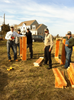Volunteers building garden boxes