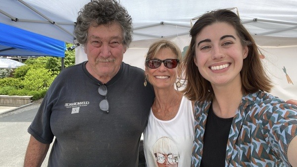 Organizers Greg Cox, Leslie Cassano, and Emma Wright (left to right) at opening market day, 2024.