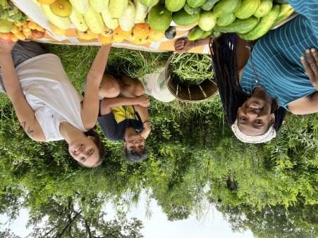 Ashni and previous farm caretaker Brisa and Volunteer Saira smiling and shining after harvest