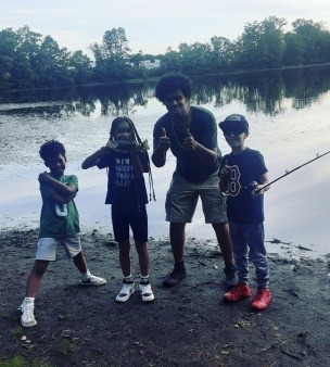 Taking a picture with the bass that we caught