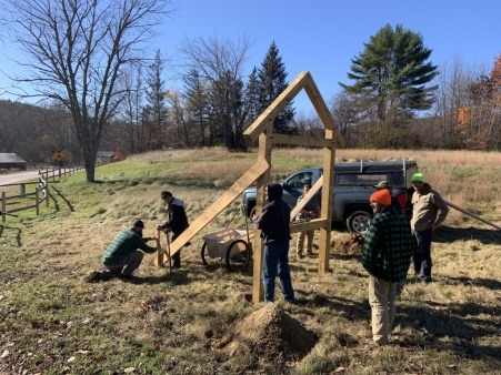 Volunteer crew raising our new sign frame