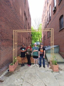 Group members celebrate finishing the installation of the pocket park