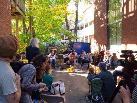 The group hosts a concert to celebrate the completion of a project.