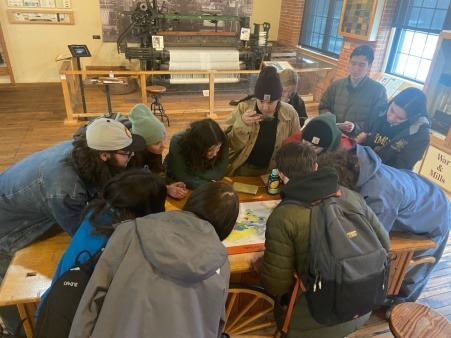UVM students studying a map of child labor issues around the globe today UVM students studying a map of child labor issues around the globe today