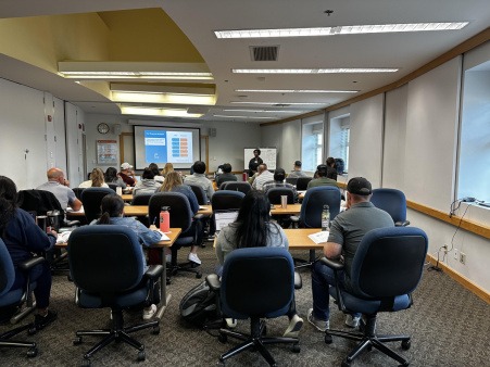 Group of participants attending a workforce training workshop in a classroom setting