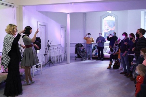 American Sign Language demonstration during Drag Queen Story Hour at Epsilon Spires