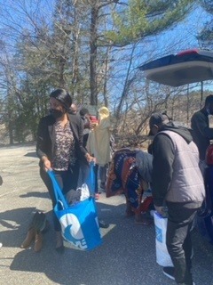 A carload of basic needs for four families