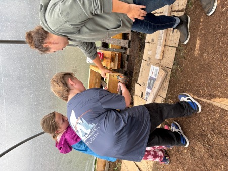 Garden Club students helping to construct raised bed garden boxes