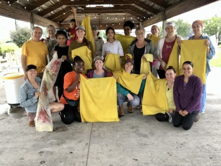 End of two day workshop. Participants show off their goldenrod dyed fabric