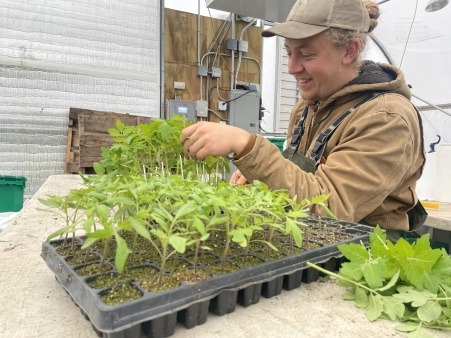 Farmer Gus Jaynes of Steadfast Farms preps for Malden Farmers Market