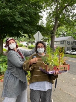 Andrea & Ellen Have a Good Laugh While Distributing Pollinator Seedlings