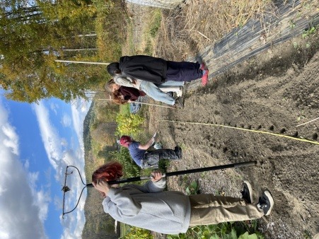 A group of teenagers plant garlic at the Food Justice Garden in Sharon Vermont