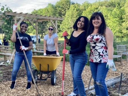 Corporate group came to help spread mulch as part of a day-long retreat 