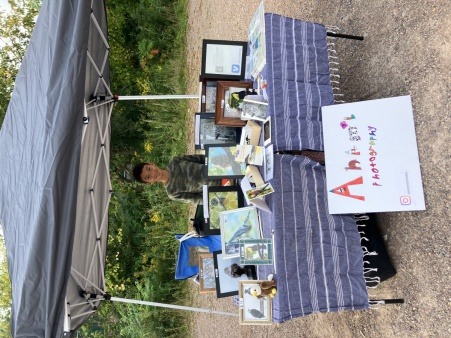 A young entrepreneur showcasing his art at youth vendor day