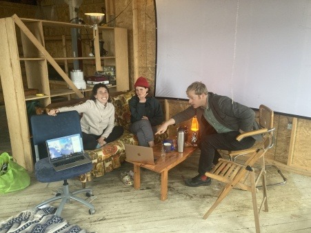 three people in a hybrid meeting at the hope st free store lounge