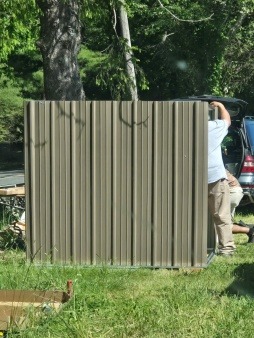 Storage shed (donated by Dream Weavers) construction by volunteers from community