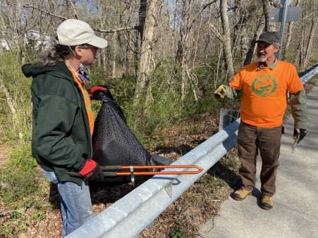 Friends of the Saugatucket members picking up litter at an Earth Day cleanup.