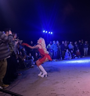 Drag queen collecting tips from the crowd (credits to Sage Durham)