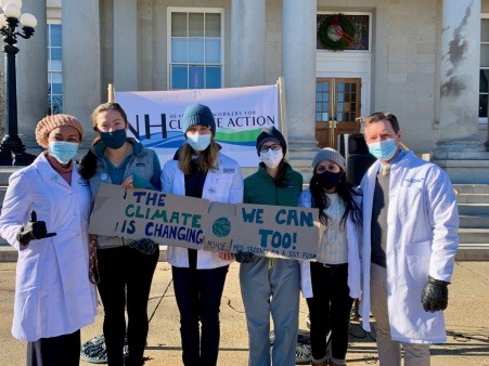 A few members of NH Healthy Climate at the organization's Public Launch, outside of the NH State House in Concord, NH in December of 2021.