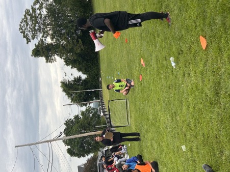 Jerry leading a mental health discussion during a soccer practice