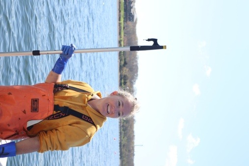 Woman on boat with kelp