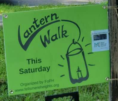 Green yard sign showing FoFH Lantern Walk logo and Malden/Massachusetts Cultural Council logos