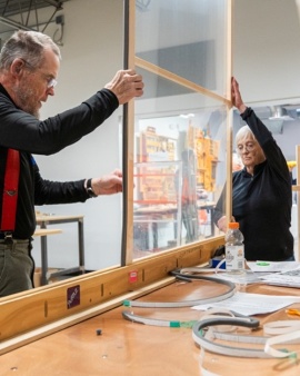 volunteers holding window insert