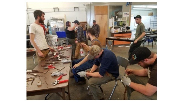 Orchard Manager Camden Walters leading a grafting workshop for the Diversified Agriculture program at Randolph Technical Career Center, a program of the local public high school.