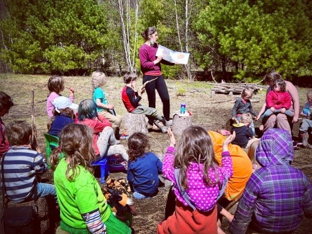 Picture of a group of kids listening to a story