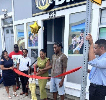Grand opening of Sin-cere Multiservice Inc.’s second community hub in Providence, with staff, partners, and residents gathered to celebrate expanded access to financial literacy and business support programs.