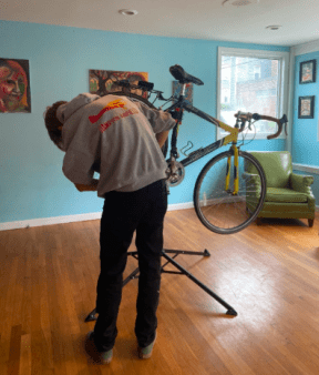 Student works on repairing a donated bike.