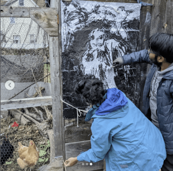 Wheatpasting Art at Food Forest site, December 2022