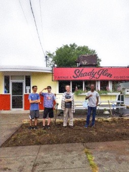 The crew after removing the grass at The Shady Glen Diner.