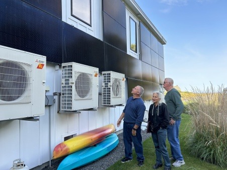 Energy Coaches look at a solar array