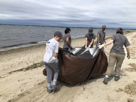 Student Stewardship Team removing debris from conservation area