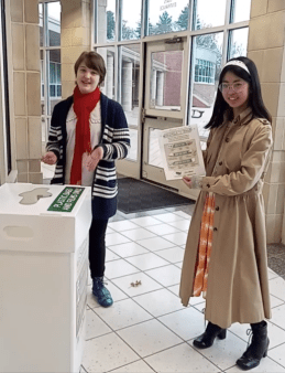 Two club co-founders promoting TREX recycling (soft-plastic recycling) at school with a skit