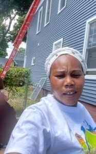 Bakhita Saabino Hard at Work Outside the House