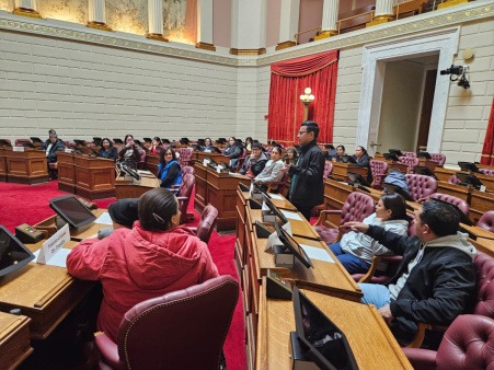 Nuevas Voces participants participate in a mock debate on the House Floor during our December 17th, 2025 field trip to the state house.